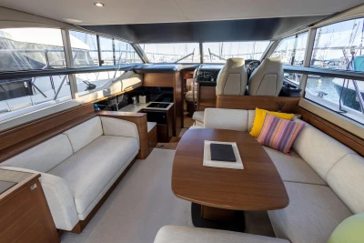 Luxurious interior of 2018 Princess 43 yacht with elegant seating and modern design.