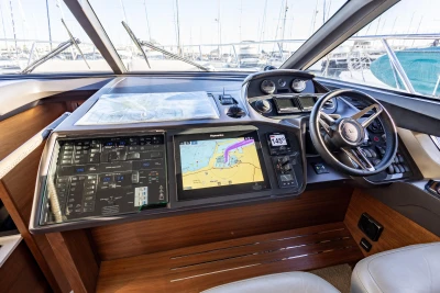 Helm of 2018 Princess 43 yacht with navigation system and steering wheel.