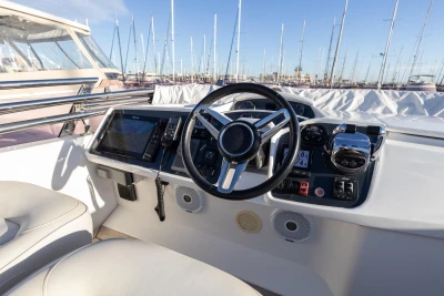 Steering console of a 2018 Princess 43 yacht with modern navigation equipment.