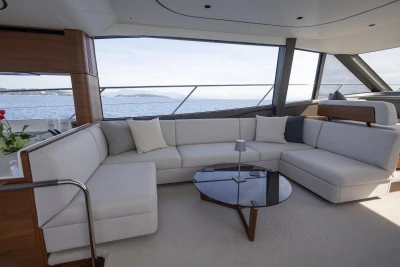 Luxurious interior of 2025 Princess F65 yacht with elegant seating and sea view.