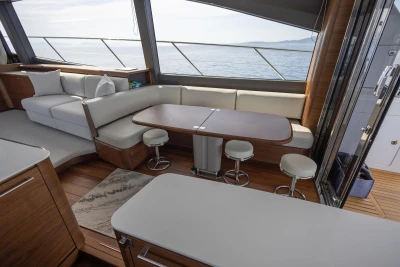 Luxurious interior of 2025 Princess F65 yacht with elegant seating and ocean view.