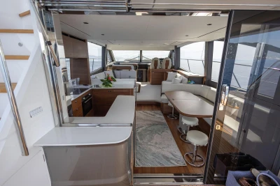 Luxurious interior of 2025 Princess F65 yacht with modern furnishings and panoramic windows.