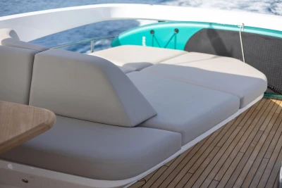 Luxurious seating on 2025 Princess F65 yacht with elegant teak decking.