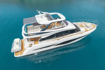 Luxurious 2025 Princess F65 yacht cruising on clear blue waters.