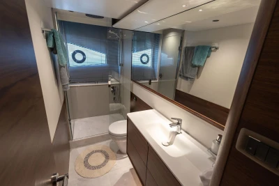Luxurious bathroom interior of 2025 Princess F65 yacht with modern fixtures and elegant design.