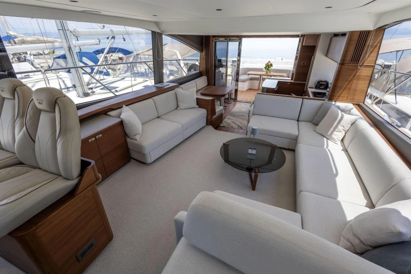 Luxurious interior of 2025 Princess F65 yacht with elegant seating and modern design.