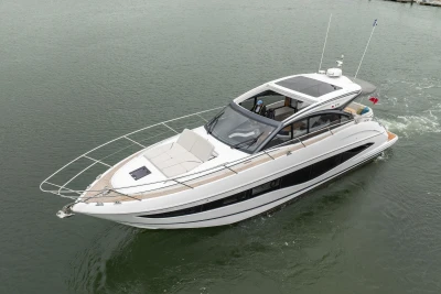 2023 Princess V50 yacht cruising on calm waters, showcasing sleek design and luxury features.
