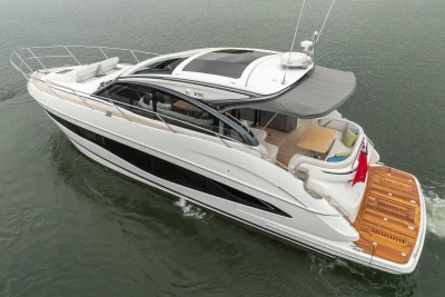 2023 Princess V50 yacht cruising on water, featuring sleek design and spacious deck.