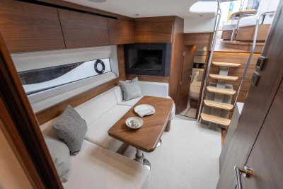 Luxurious interior of 2023 Princess V50 yacht with elegant seating and modern design.