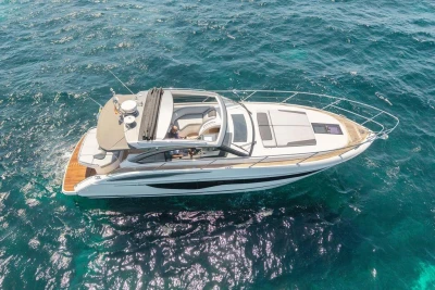 Luxury 2018 Princess V40 yacht cruising on clear blue ocean waters.