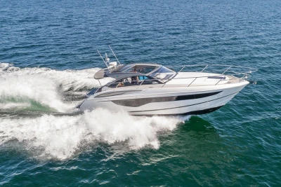 2018 Princess V40 yacht cruising on open sea, creating waves.
