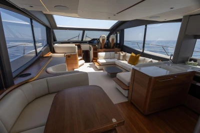 Luxurious interior of 2023 Princess S72 yacht with elegant seating and panoramic windows.