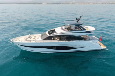 Luxurious 2023 Princess S72 yacht cruising on calm blue waters.