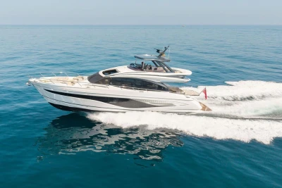 Luxurious 2023 Princess S72 yacht cruising on open sea, showcasing sleek design and elegance.