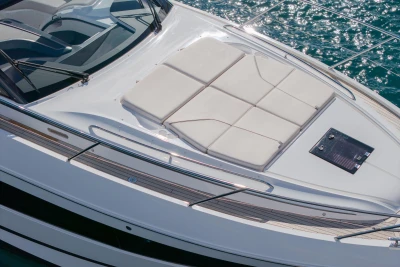 2024 Princess V50 Open yacht with sunbathing deck on sparkling water.