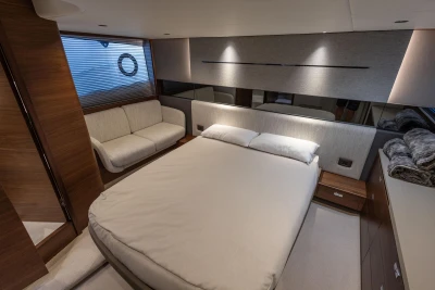 Luxurious bedroom interior of 2024 Princess V50 Open yacht with modern design.