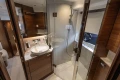 Luxurious bathroom interior of 2024 Princess V50 Open yacht, featuring modern fixtures and wood accents.