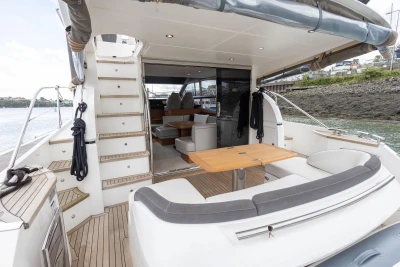 Luxurious 2015 Princess 43 yacht with elegant interior and spacious deck seating.