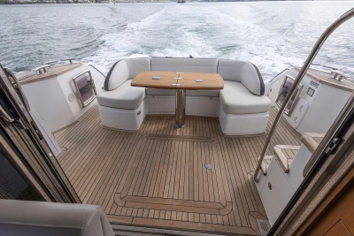 Luxurious 2015 Princess 43 yacht with elegant teak deck and comfortable seating area.