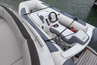 Inflatable boat on a 2015 Princess 43 yacht, docked by the water.