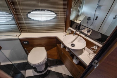 Luxurious bathroom in 2015 Princess 43 yacht with modern fixtures and elegant design.