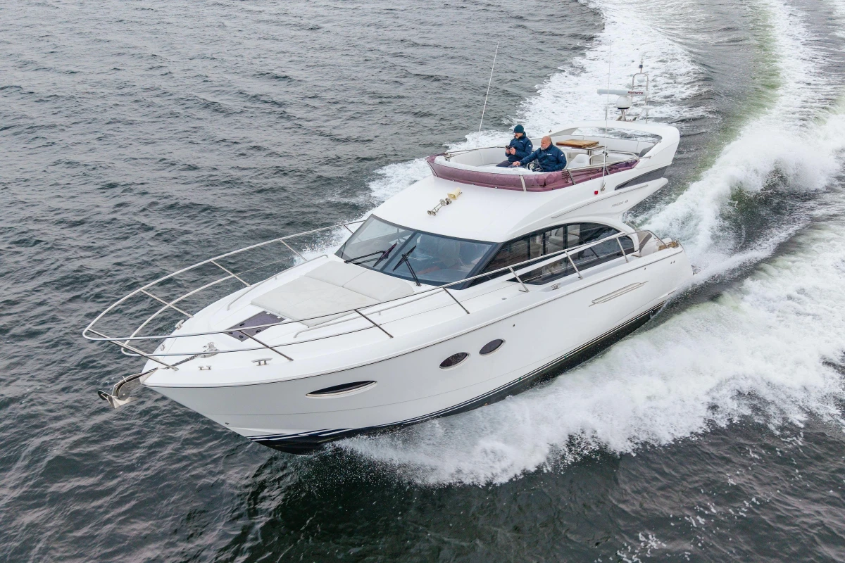 2017 Princess 43 yacht cruising on open water, showcasing sleek design and luxury features.