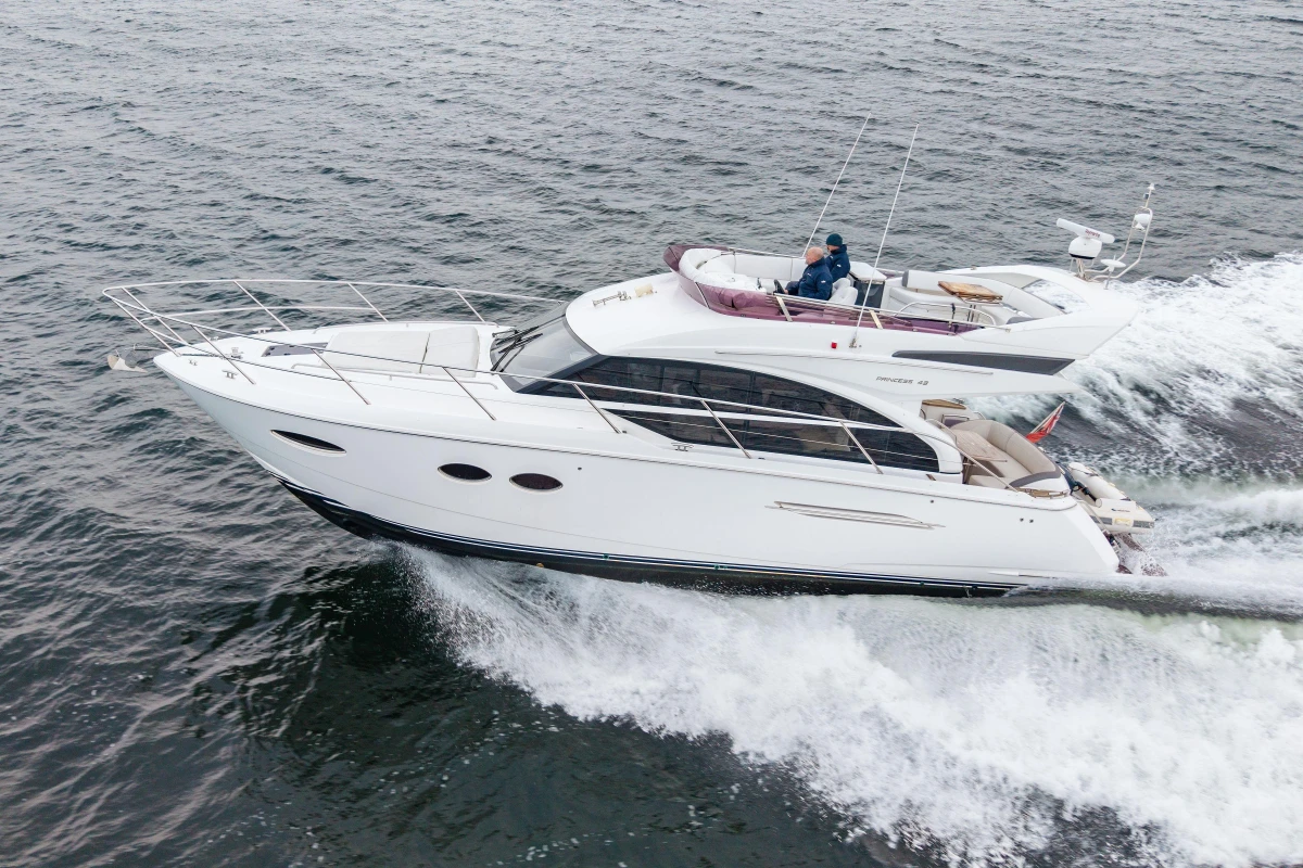 2017 Princess 43 yacht cruising on open water, showcasing sleek design and luxury features.