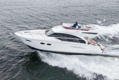 2017 Princess 43 yacht cruising on open water, showcasing sleek design and luxury features.