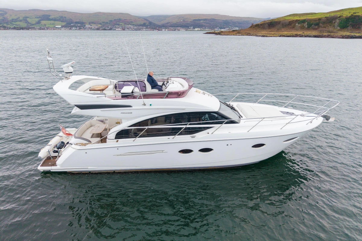 Luxury 2017 Princess 43 yacht cruising on scenic waters.