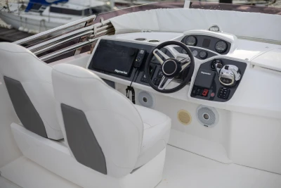 Cockpit of 2017 Princess 43 yacht with modern navigation equipment and dual seats.