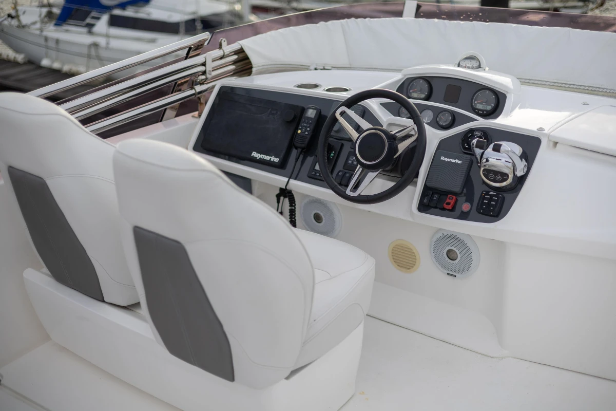 Cockpit of 2017 Princess 43 yacht with modern navigation equipment and dual seats.
