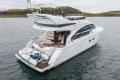 Luxury 2017 Princess 43 yacht on serene water, showcasing elegant design and spacious deck.