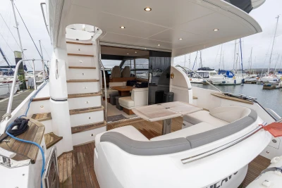 Luxurious 2017 Princess 43 yacht with elegant seating and marina view.
