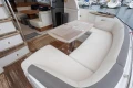Luxurious 2017 Princess 43 yacht interior with elegant seating and wooden table.