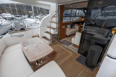 Luxurious 2017 Princess 43 yacht interior with elegant seating and wooden deck.