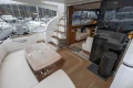 Luxurious 2017 Princess 43 yacht interior with elegant seating and wooden deck.