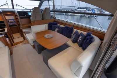 Luxurious interior of 2017 Princess 43 yacht with plush seating and nautical decor.