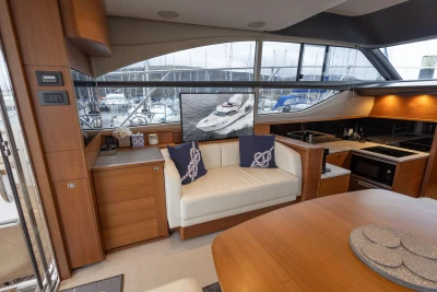 Luxurious interior of 2017 Princess 43 yacht with modern kitchen and seating area.