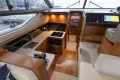 Luxurious interior of a 2017 Princess 43 yacht featuring a modern kitchen and navigation area.