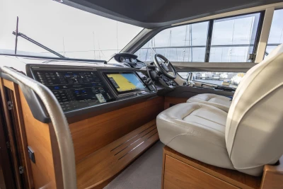 Interior of 2017 Princess 43 yacht cockpit with modern navigation controls and leather seating.