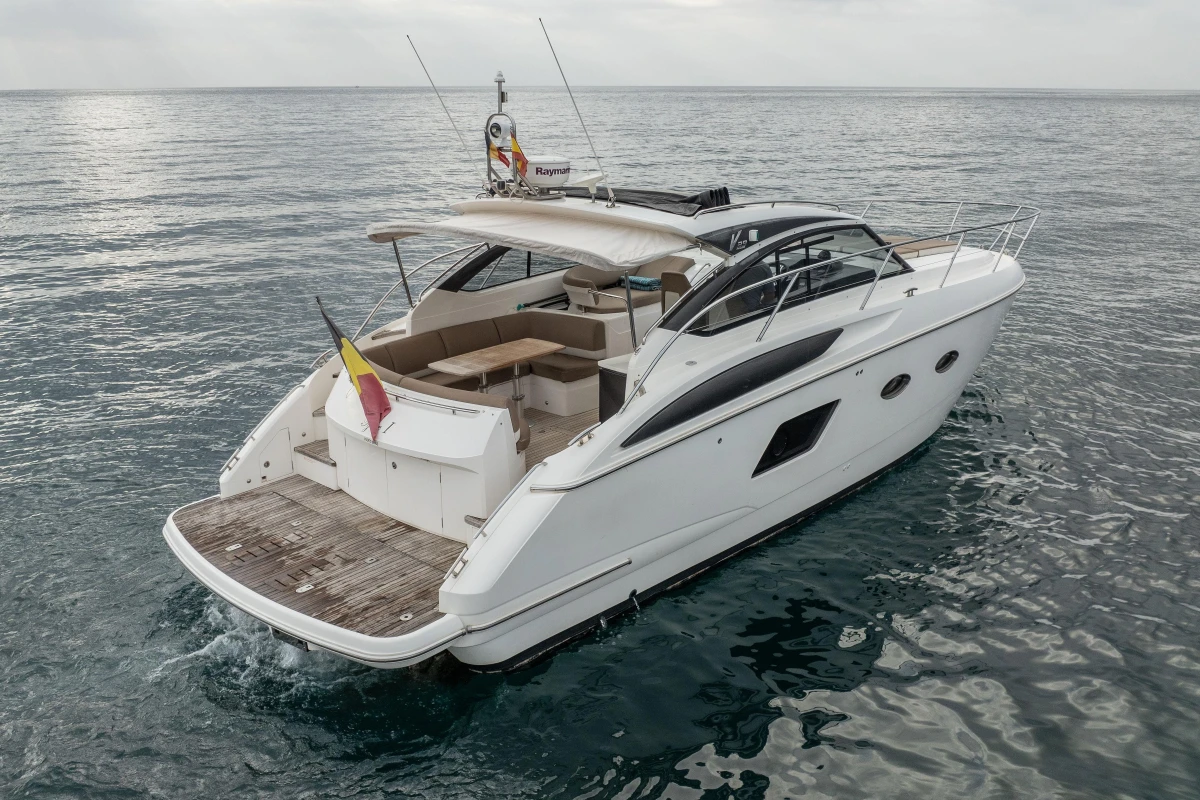 2014 Princess V39 yacht cruising on open water, rear view.