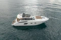 2014 Princess V39 yacht on calm water, side view.