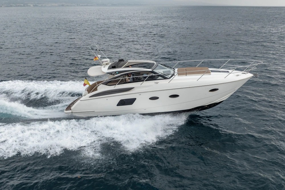 2014 Princess V39 yacht cruising on open water, showcasing sleek design and performance.