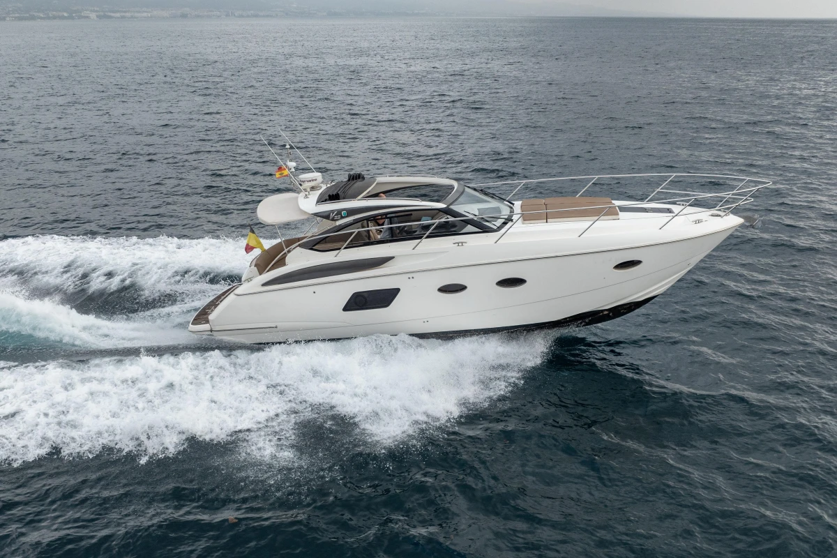 2014 Princess V39 yacht cruising on open water, showcasing sleek design and performance.