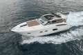 2014 Princess V39 yacht cruising on open water, side view.