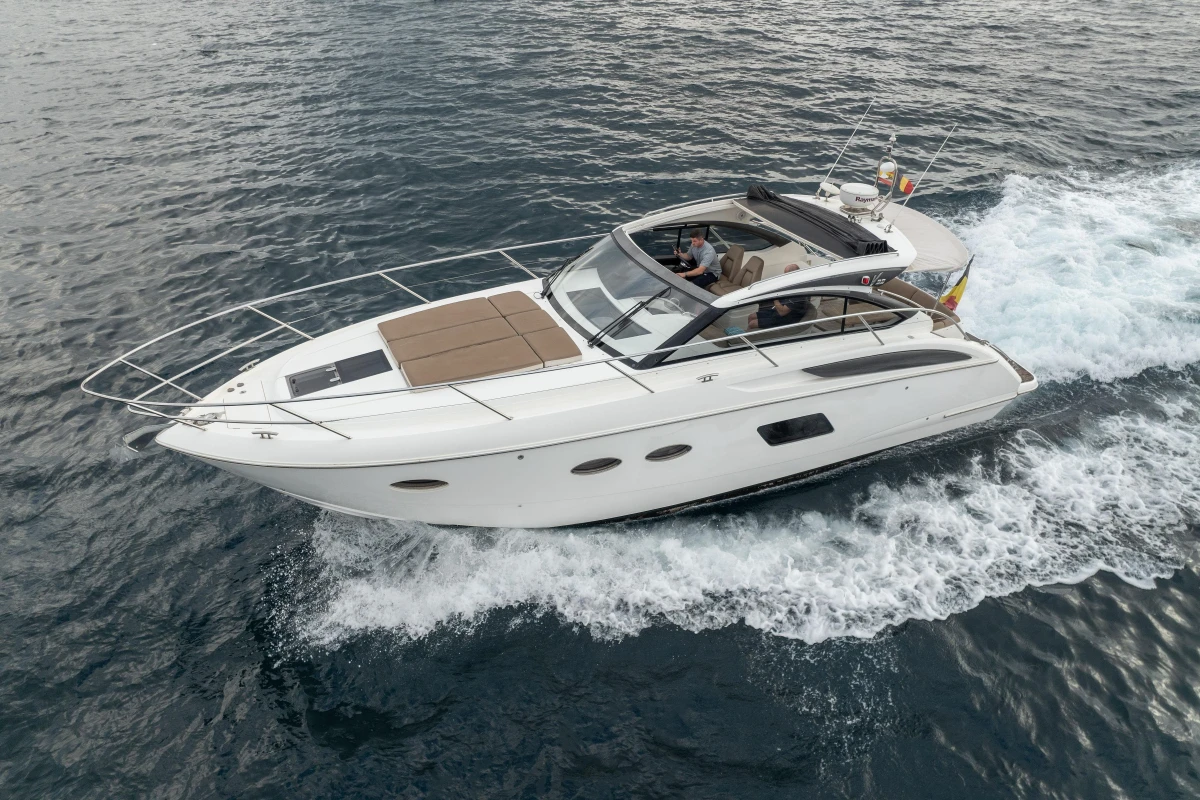 2014 Princess V39 yacht cruising on open water, side view.