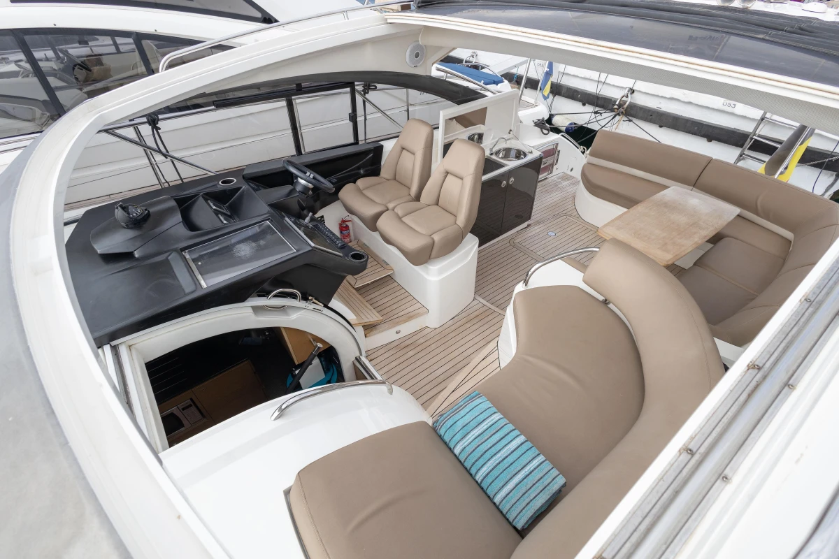 2014 Princess V39 yacht interior with luxurious seating and modern helm.