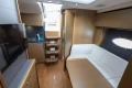 Luxurious interior of 2014 Princess V39 yacht with modern furnishings and wooden accents.