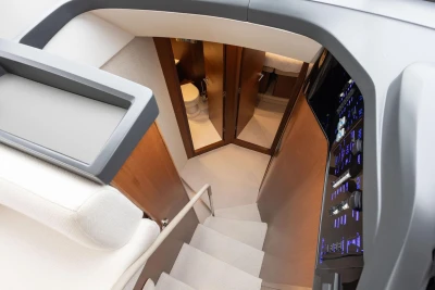 Interior view of 2018 Princess 49 yacht, featuring stairs and control panel.