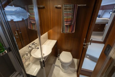 Luxurious 2018 Princess 49 yacht bathroom with modern fixtures and colorful towels.
